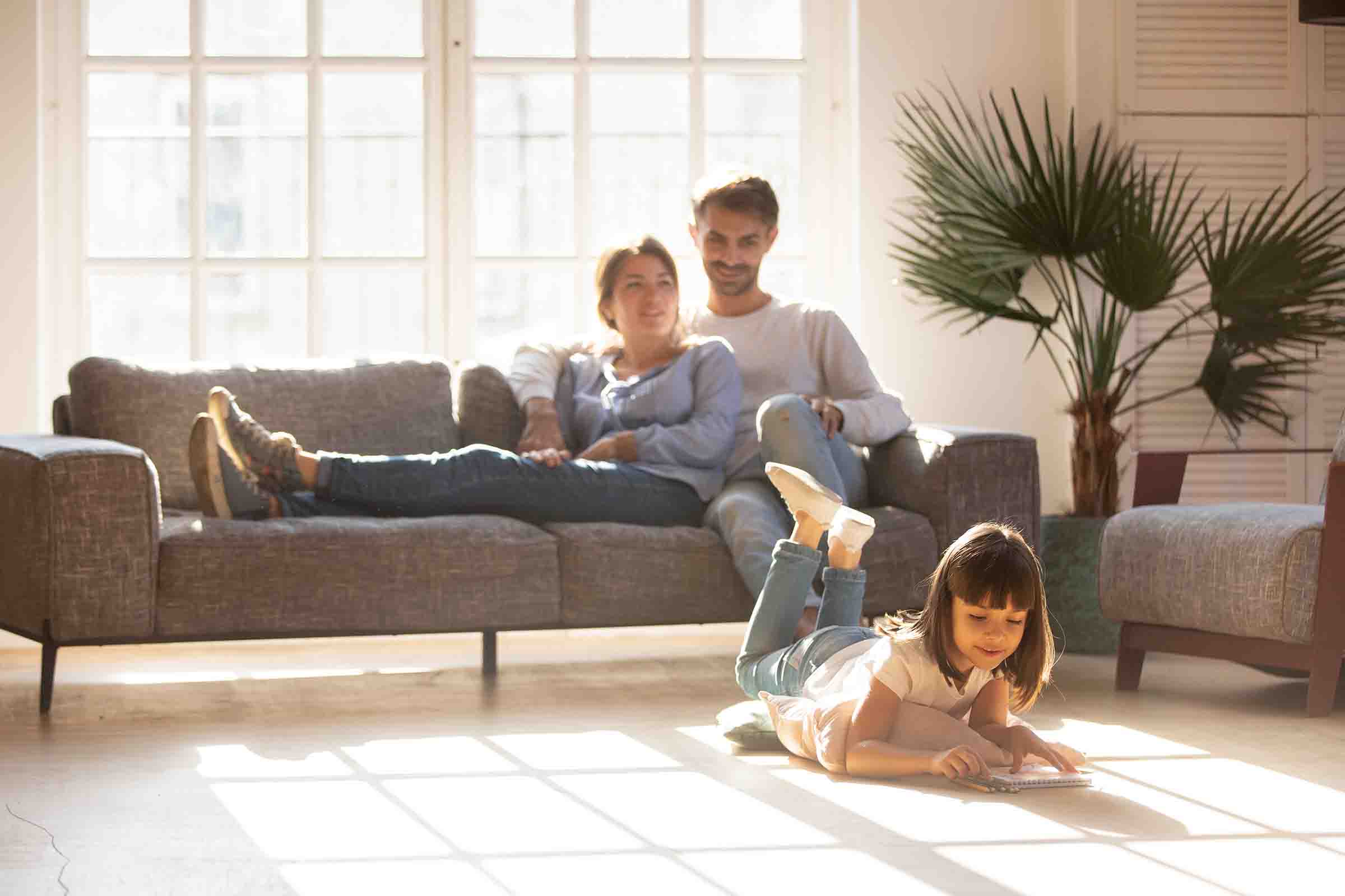 Family enjoying warmth on couch