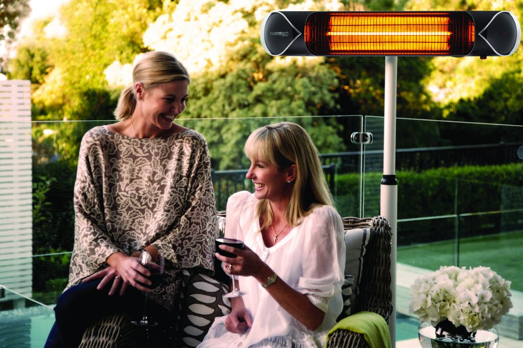 Ladies enjoying outdoor moderno heater