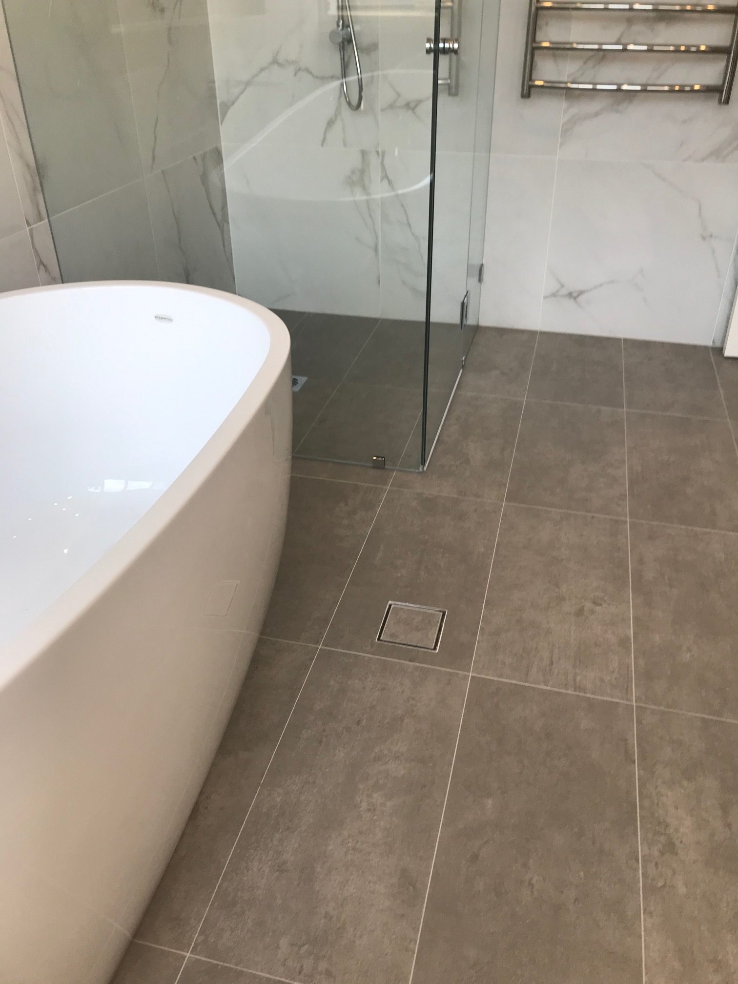 grey Marble bathroom floor with Warmtech Inscreed heating system